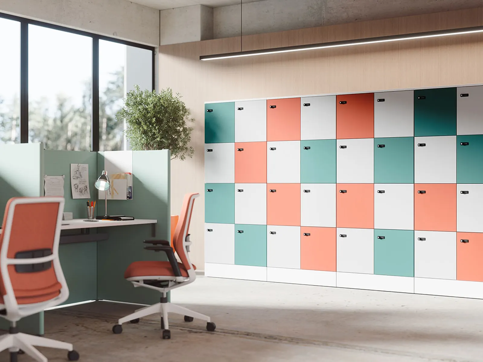 Pared de taquillas Actiu Postal en varios colores, usada como divisor en una oficina de puesto compartido